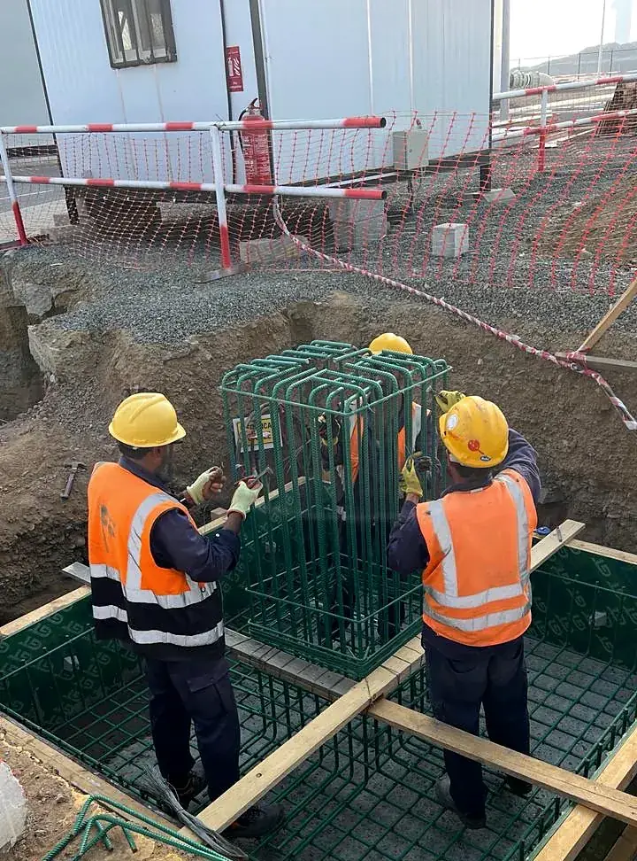 Engineers checking column reinforcement cages