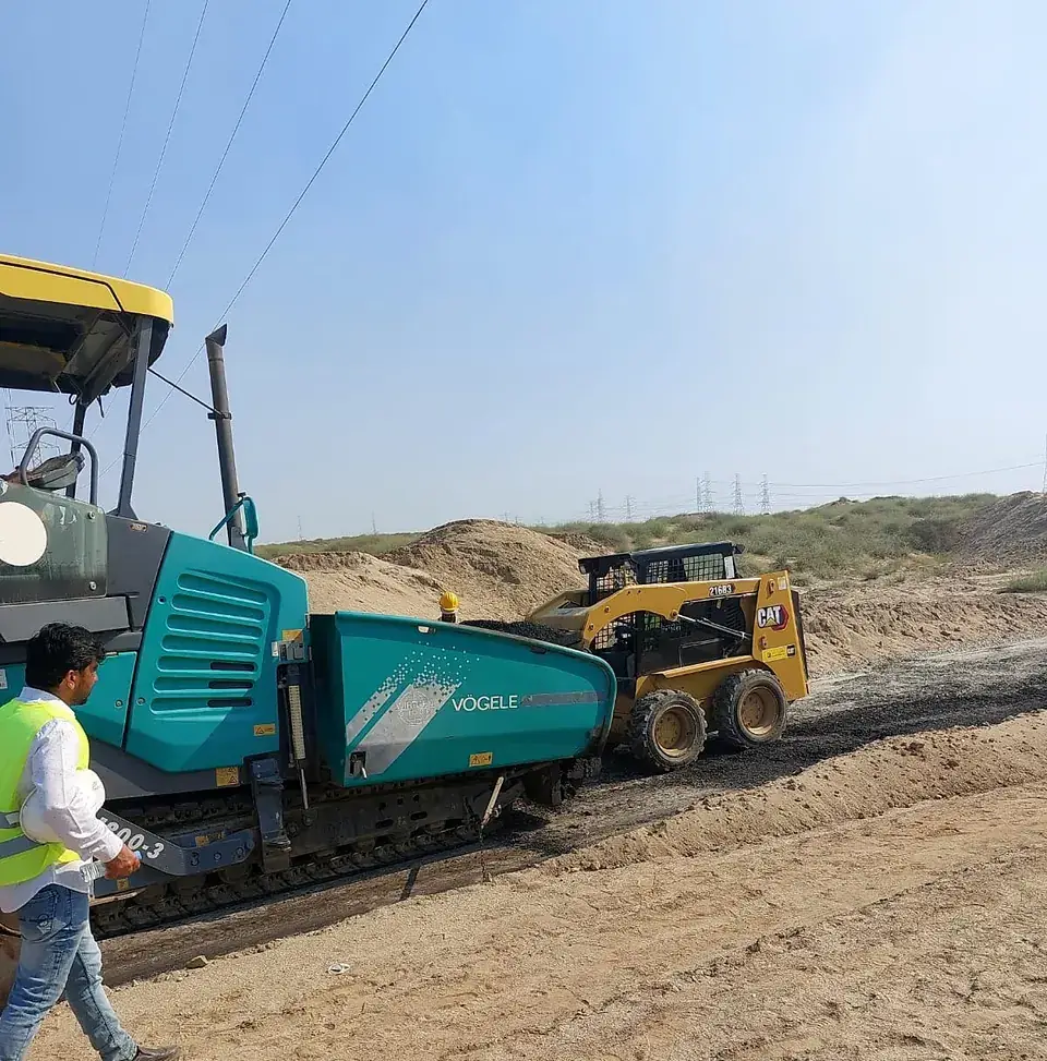 Asphalt paver laying a patrol road